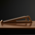 Oakstead walnut laptop stand side angle showing triangular cutouts